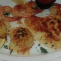 Broiled Seafood Combination · Crab cake, flounder, tilapia and jumbo shrimp with tartar sauce or cocktail sauce. Served wi...