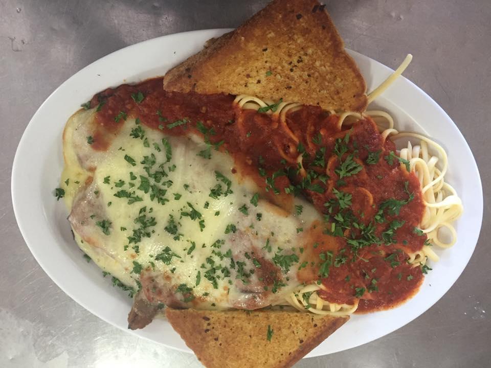 Eggplant Parmigiana · Served with tomato sauce and melted mozzarella cheese. Includes soup or tossed salad, garlic bread and pasta. NOTE:  If choosing a soup, please type your choice in special instructions. Soup du Jour is listed in Soup description section.