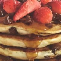 Fruit Pancakes · Includes choice of fresh fruit (apple, strawberry, banana or blueberry) topped with whipped ...