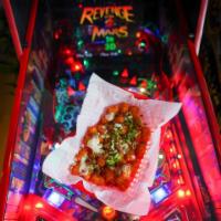 Hot Axe Tots · Buffalo-style with bacon and scallions. Drizzled with hot sauce and our housemade blue chees...