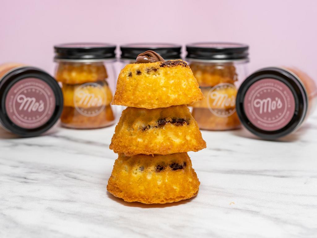 Nutella  Mo's Cake Jar · Mo's Cake Jars make a sweet treat for anyone! Stacked with 3 bite-sized bundt cakes in a cute jar they are the perfect choice a for personal treat. Available in 4 flavors. The jar contains 3 bundt cakes all the same flavor.
