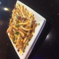Buried in Cheese Fries · Seasoned fries topped with melted Monterey Jack and cheddar cheeses, bacon pieces, and chive...