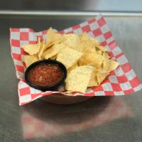 Chips and Salsa · With our homemade queso con carne.