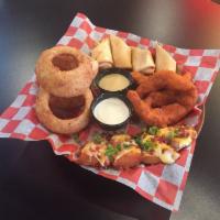 Boomerang Sampler · 4 hand-breaded onion rings, 2 pieces southwest egg roll, 4 pieces spicy buffalo chicken tend...