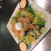 Southwest Salad · Grilled southwest marinated chicken on chilled mixed greens with black beans, cheddar cheese...