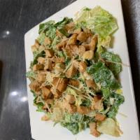 Chicken Caesar Salad · Crisp chilled romaine lettuce tossed with creamy Caesar dressing, toasted seasoned croutons,...
