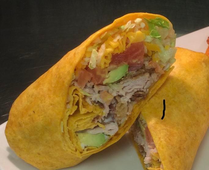Turkey Avocado Wrap · A cheddar and jalapeno tortilla filled with sliced smoked turkey with chilled lettuce, hickory-smoked bacon pieces, diced tomatoes, Monterey Jack and cheddar cheeses, avocado, and ranch dressing.