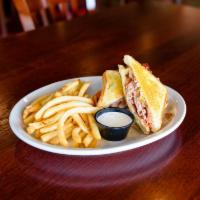 California Club Sandwich · Grilled sliced smoked turkey, smoked bacon, Monterey Jack cheese, tomatoes and guacamole on ...