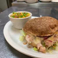 Turkey Trotter Sandwich · Grilled sliced smoked turkey with Monterey Jack cheese, mayo, lettuce, tomatoes, and red oni...