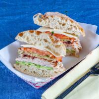 Sunset Sandwich · Turkey, bacon, avocado, provolone, tomato, lettuce, siracha mayo on ciabatta bread.