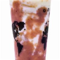 Taro Cream Brûlée Milk Tea · Milk black tea with fresh taro in it and milk foam on top.