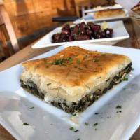 Spanakopita · Spinach pie with feta and herbs baked in phyllo dough.