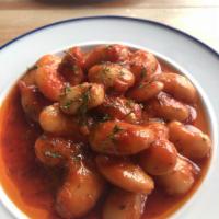 Gigantes · Sauteed Lima beans in a light tomato sauce.