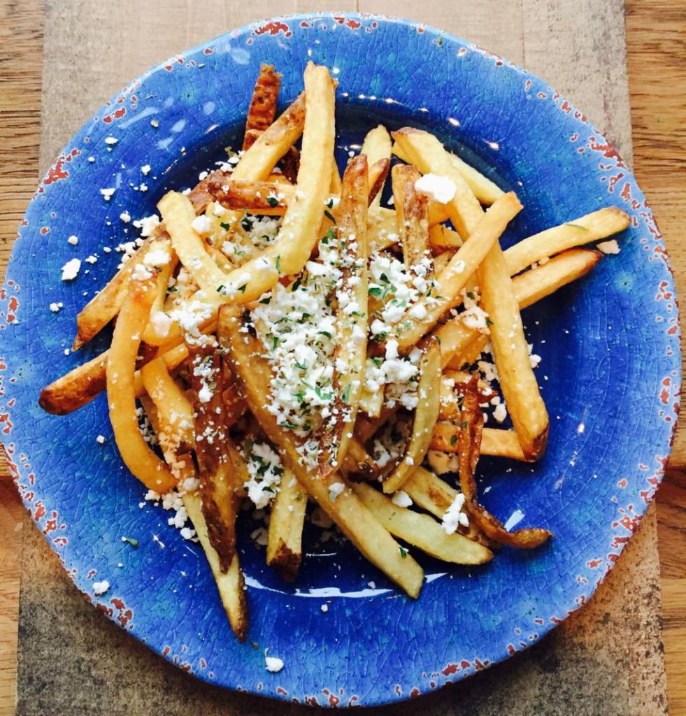 Greek Style Fries · Fresh cut with crumbled feta and oregano.