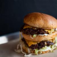 The Nation Burger · Two 4oz beef patties, American cheese, shredded lettuce, pickles, onions, 1000 Island dressi...