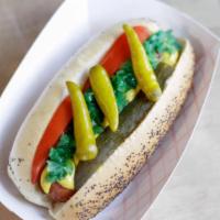 Party Dog · Traditional Chicago dog, tomatoes, pickles, sweet relish, mustard and sport peppers.