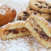 Deep-Fried Chocolate Chip Cookies · 3 or 5 chocolate chip cookies dipped in funnel cake batter, fried, and coated in powdered su...