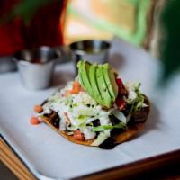 Tostadas · Fried corn tortilla topped with any meat or chicken. Sour cream, lettuce, pico de gallo, che...
