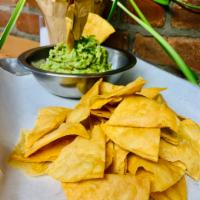 Chips and guacamole. · Home made corn chips, fresh avocados,red onion.cilantro, lime juice.