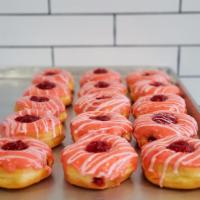 Cherry Bits Glazed Donut · Cherry glazed donut filled with cherry bits and lastly... drizzled in light vanilla cherry i...