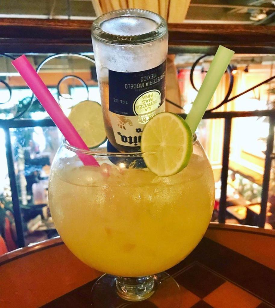 Mama Margarita  · Must be 21 to purchase. Tequila, margarita sour mix, lime orange liqueur, topped with a baby Coronita.
