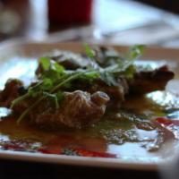 Costillas de Cerdo · Pork ribs cooked in green homemade sauce (jalapeno, tomatillo, squash, garlic, onions and ci...