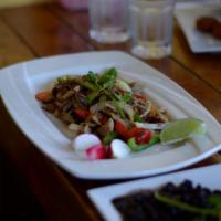 Carnitas China Poblana · Sautéed pork, onion, peppers, served with rice, beans and corn tortillas topped with avocado...