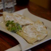 Chicken Quesadilla · Flour tortilla with shredded chicken and melted mozzarella cheese. Topped with sour cream an...