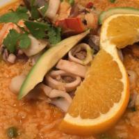 Arroz Marinero · Combination of yellow rice with mixed seafood (shrimp, clams, mussels, lobster tail, calamar...