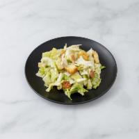 Caesar Salad · Croutons and shaved Parmigiano.