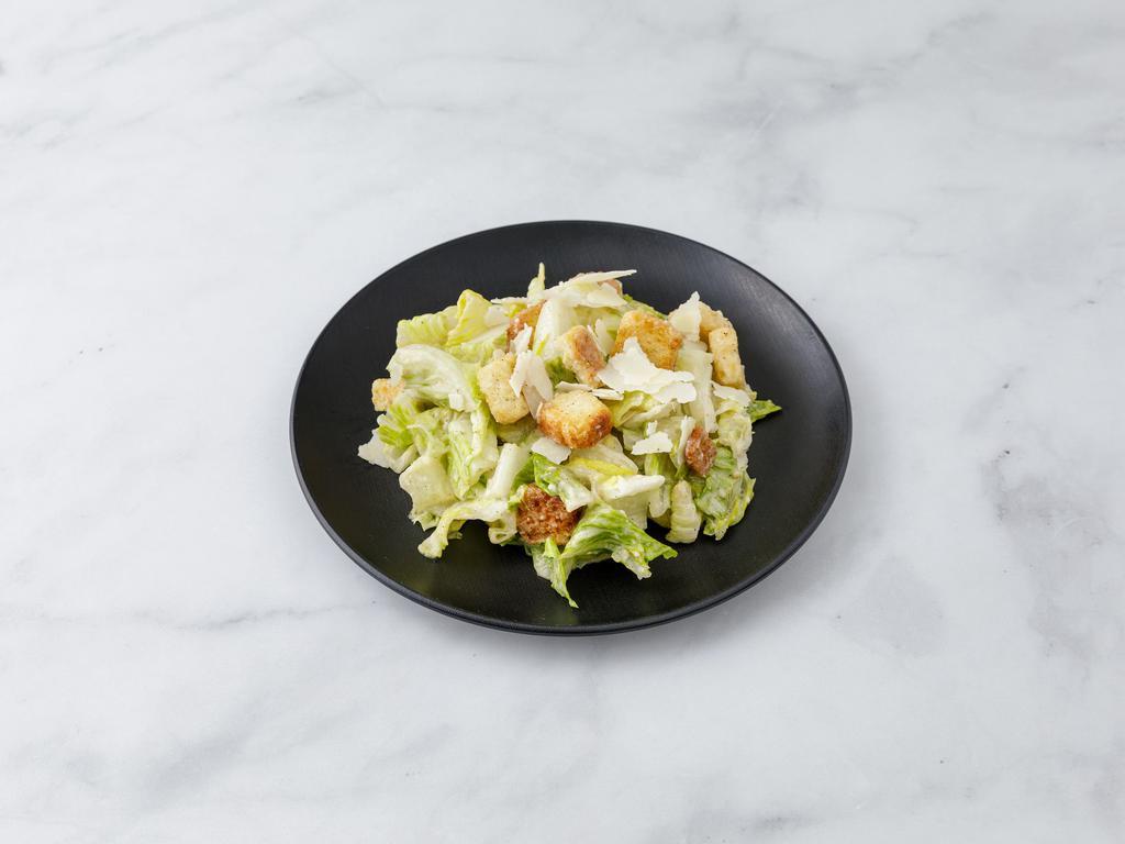 Caesar Salad · Croutons and shaved Parmigiano.