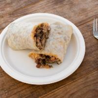 Burrito · Burrito has onion, cilantro, sour cream, avocado sauce, rice, beans, and meat of your choice.