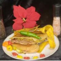 Angry Cuban Sandwich · Fresh Cuban bread, pork roast, ham, Swiss cheese, mustard, pickles, habanero and serrano pep...