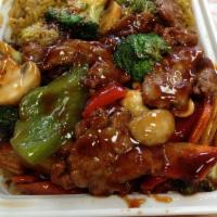 B9. Beef with Garlic Sauce (鱼香牛) · Served with white rice. Hot and spicy.