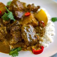 B11. Beef with Curry Sauce (咖喱牛) · Served with white rice. Hot and spicy.