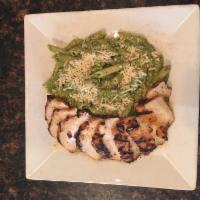 Basil Chicken Penne Dinner · Grilled marinated chicken breast with garlic and pesto cream sauce and Parmesan cheese.