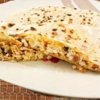 Spiced Paneer Naan · Spiced grated paneer stuffed in naan and baked in the clay oven.