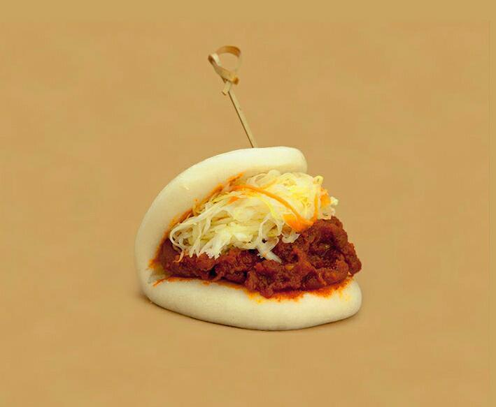 9. Spicy Pork Bun · Marinated pork with go-chu-jang sauce and coleslaw. Spicy.