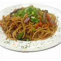 Tallarin Saltado De Carne · Linguini Sautéed with Peruvian Soy Sauce, Strips of Steak, Onions and Tomatoes.