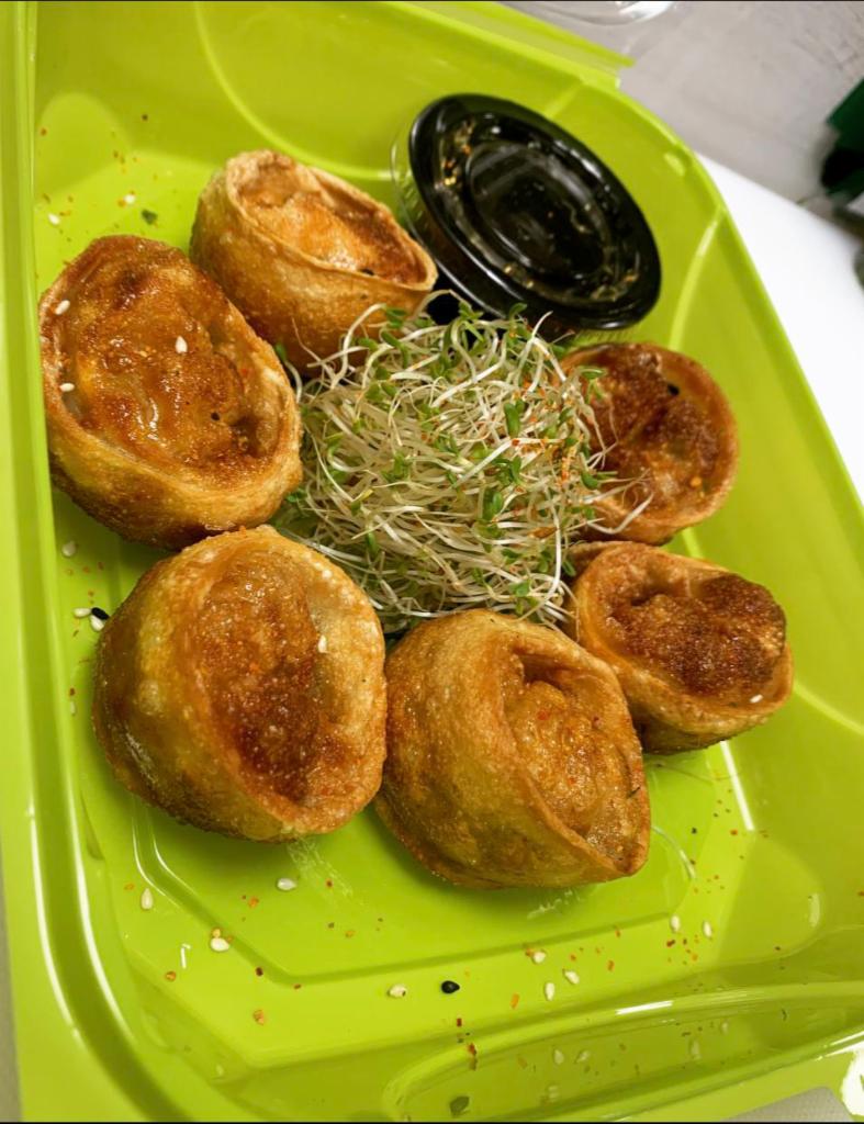 Vegetable Dumplings  · 6 fried vegetable dumplings inside garlic, green onion, leek, onion, cabbage and ginger. Served with yuzu ponzu or sweet chili sauce