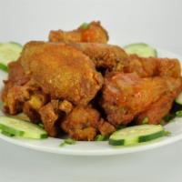 Buffalo Wings · Pieces of spicy wings. 