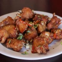 Cha Chi Kai Chicken · Cut wings made with hot peppers and scallions. 