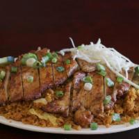 Jerk Chicken Fried Rice · Grilled chicken breast with jerk seasoning on top of fried rice. 