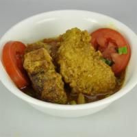 Curry Fish (Snapper) · Served with rice, roti or dhall puri. 