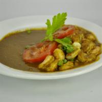 Curry Shrimp · Served with rice, roti or dhall puri. 