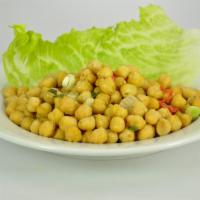 Boil and Fried Chana (garbanzo beans) · Garbanzo beans sautéed with garlic and onions.