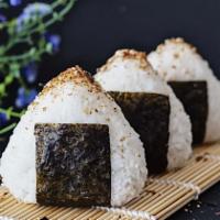 Spicy Crab Onigeri · 2 pieces onigeri spicy crab and oshinko indide Japanese yellow raddish wrapped with sushi ri...