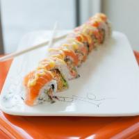 Sushi Wee Special Roll · Spicy crab, avocado topped with salmon, fluke, and striped bass, drizzled with mango sauce.