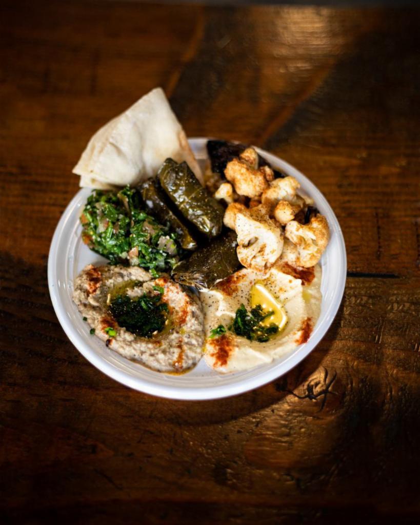 Mixed Vegetarian Platter · Hummus, Baba ghanosh, tabbouleh, fried cauliflower and eggplant.