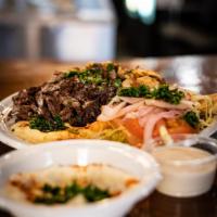 Meat Shawarma Platter · lamb, rice, salad, tahini sauce, & bread